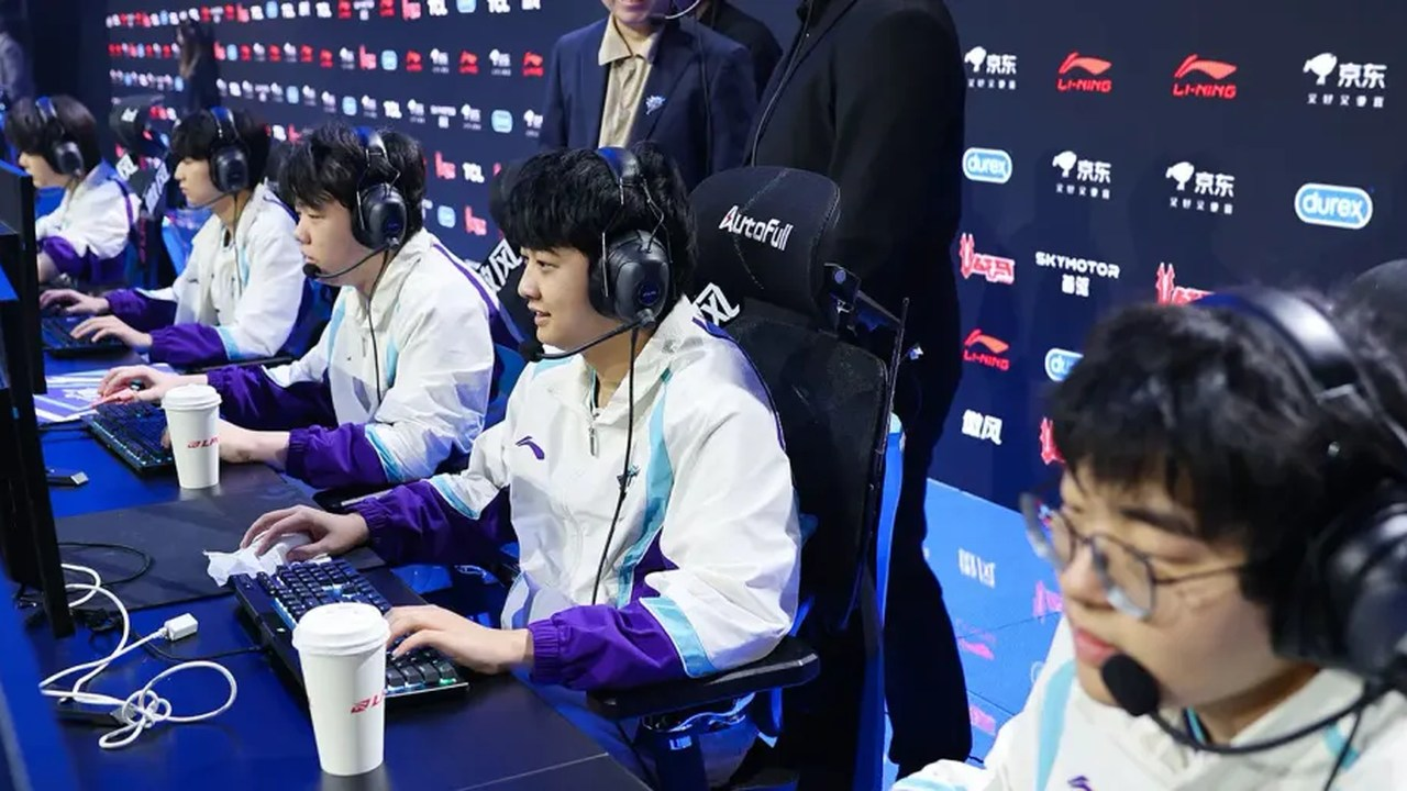 LGD Gaming players compete at their tournament computers