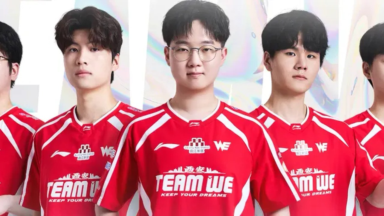 Team WE players pose together in red jerseys