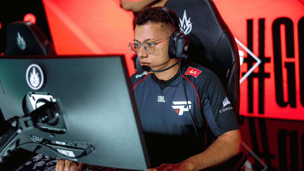 A paiN Gaming Academy player sits at a League of Legends match station