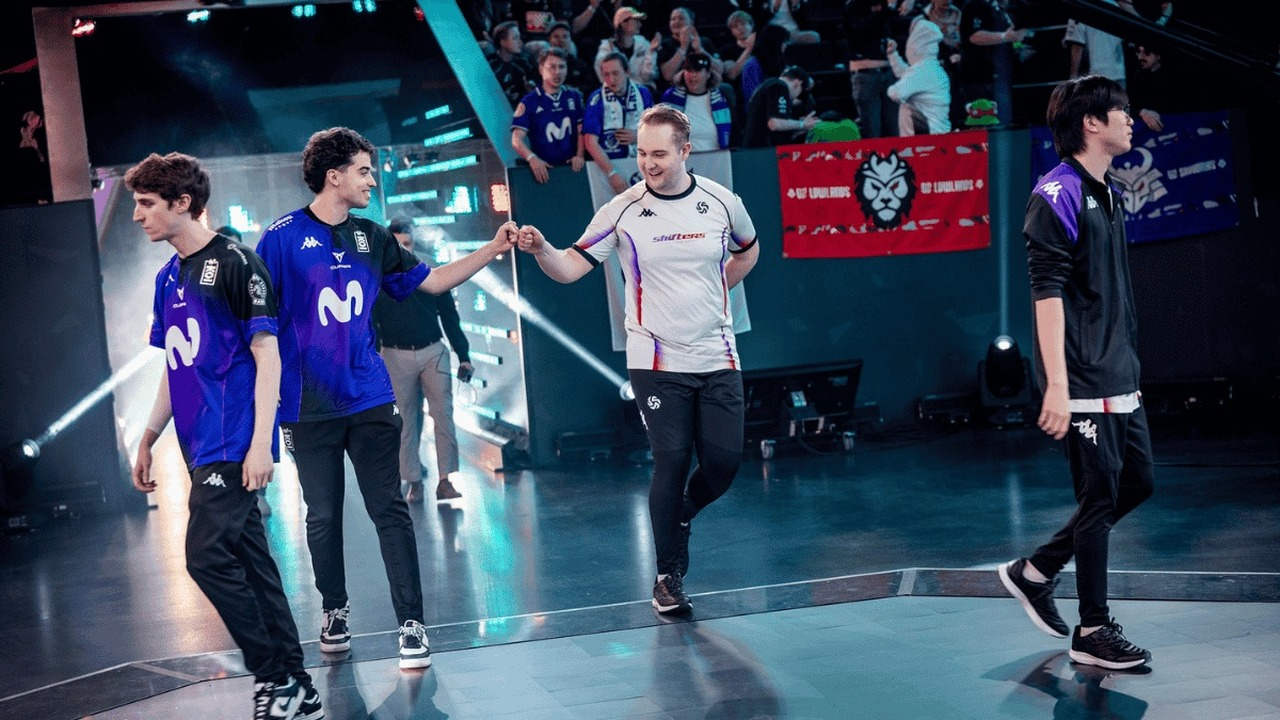 A Shifters player fist-bumps an opponent on the LEC stage